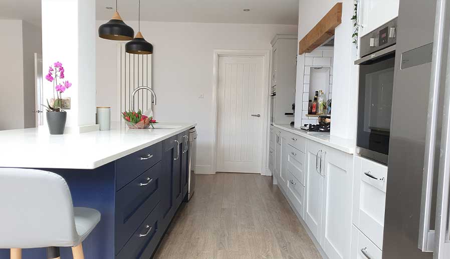 Contemporary blue and grey shaker kitchen in Cardiff