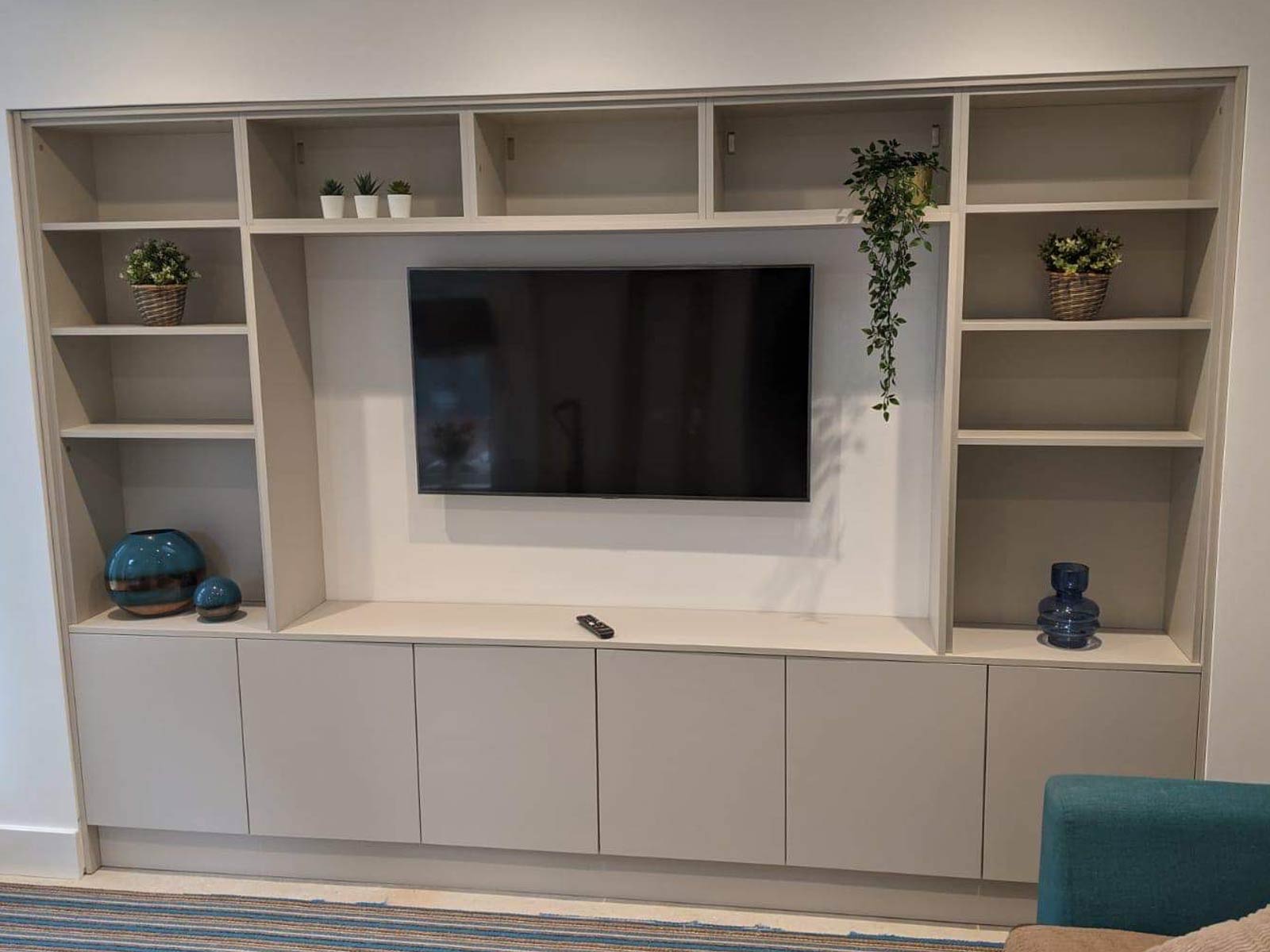 TV Media wall shelves used as a kitchen space-saving solution