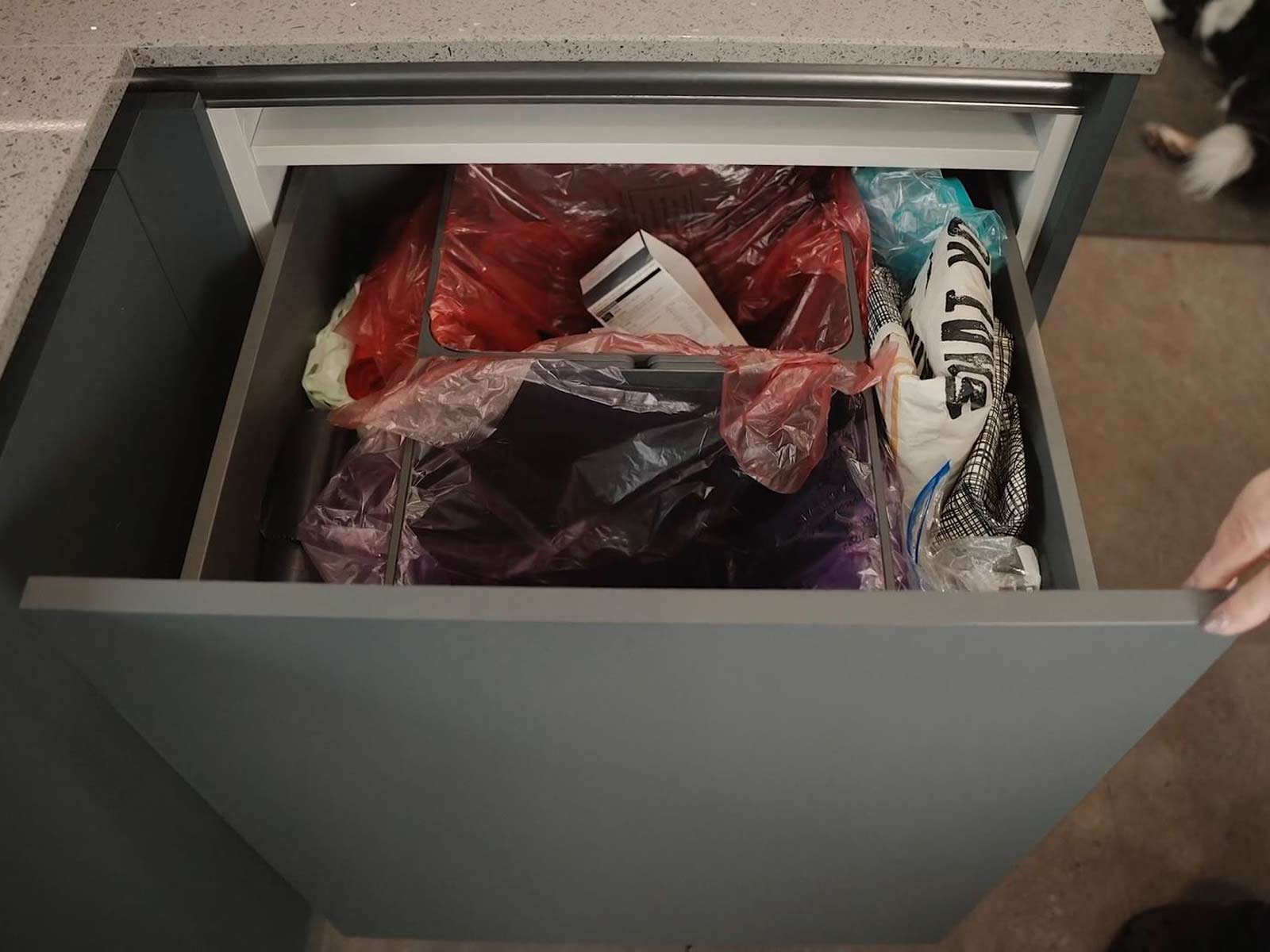 A kitchen bin for recycling hidden away in a pull-out kitchen drawer