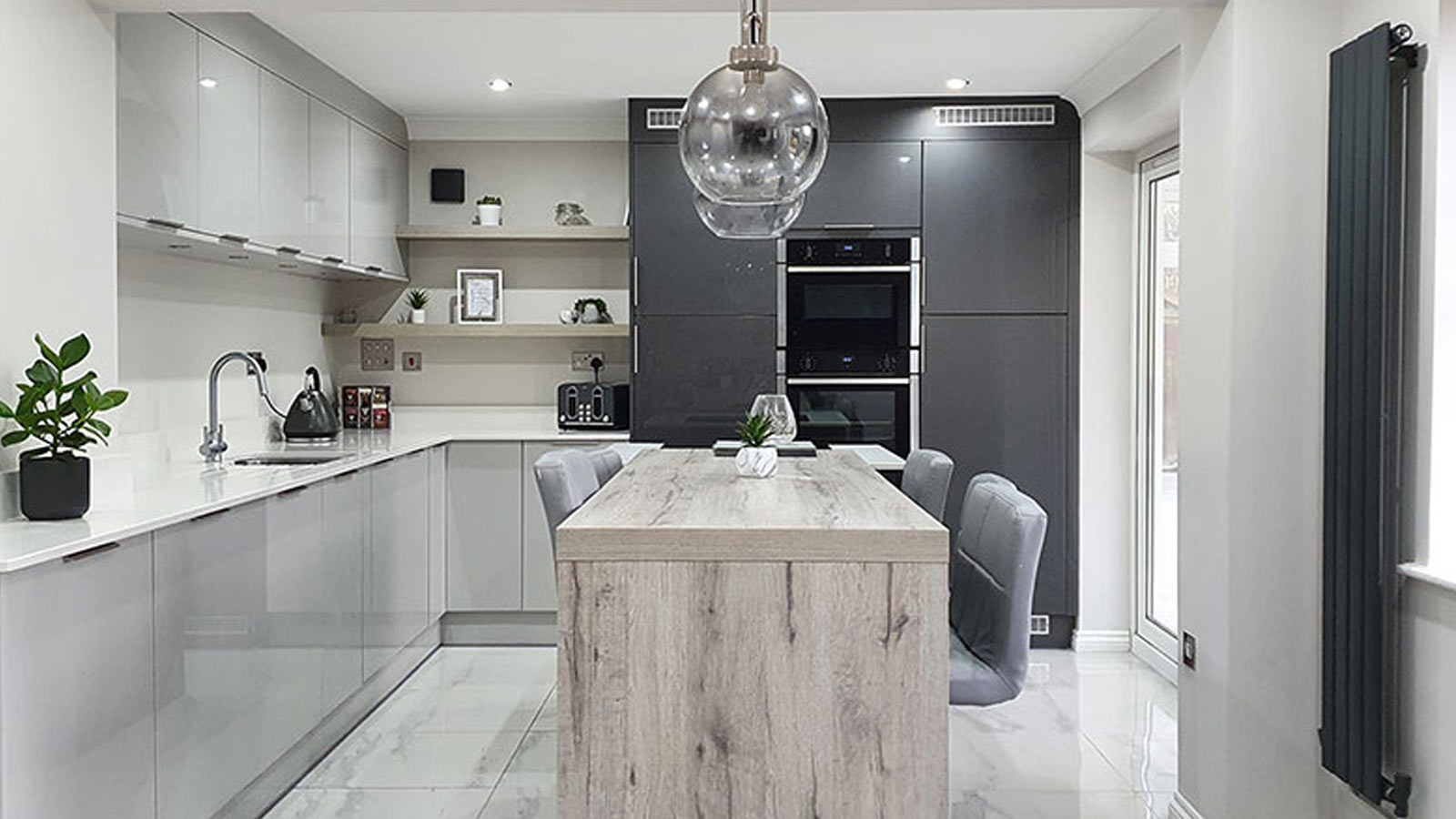 Modern kitchen with light grey kitchen base units and dark grey kitchen units