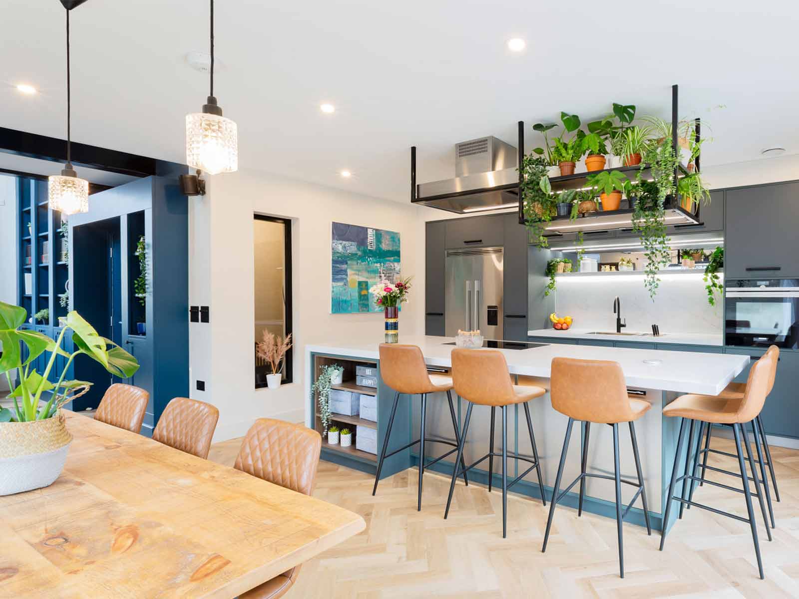 A kitchen with lots of natural light, following biophilic design best practices