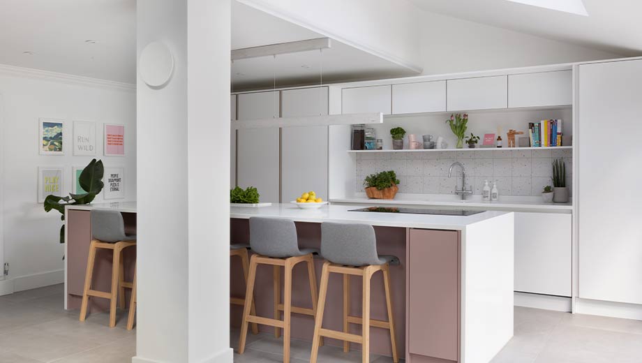 Grey kitchen with pink kitchen island