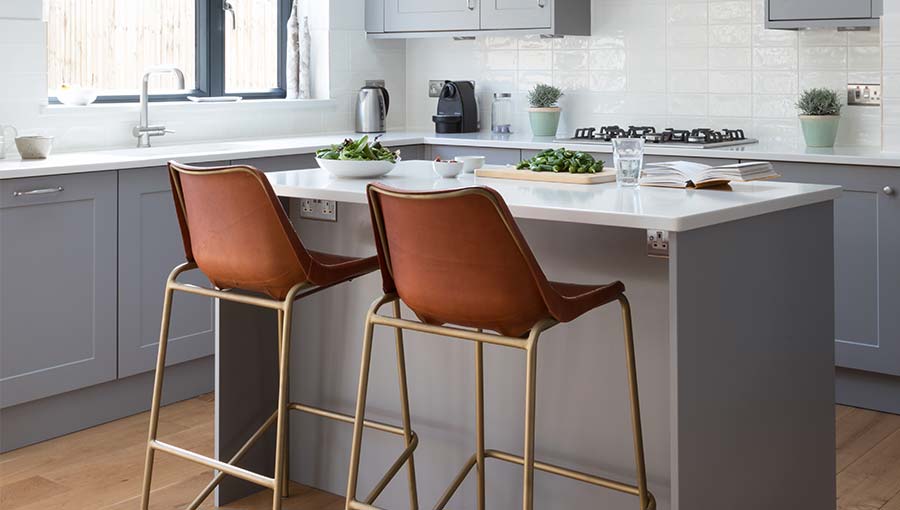 Small kitchen island in a shaker kitchen