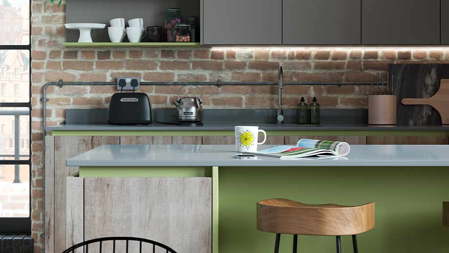 Modern kitchen featuring green handle rails and wood finishes