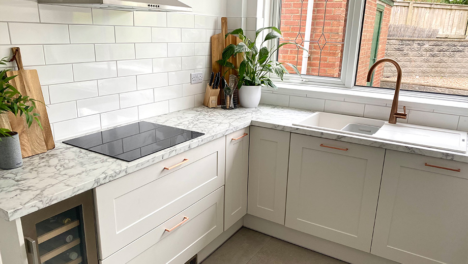 Grey shaker kitchen with copper accents