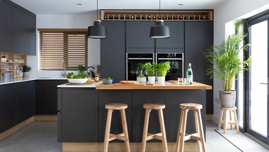 Dream modern kitchen featuring dark kitchen doors and kitchen island