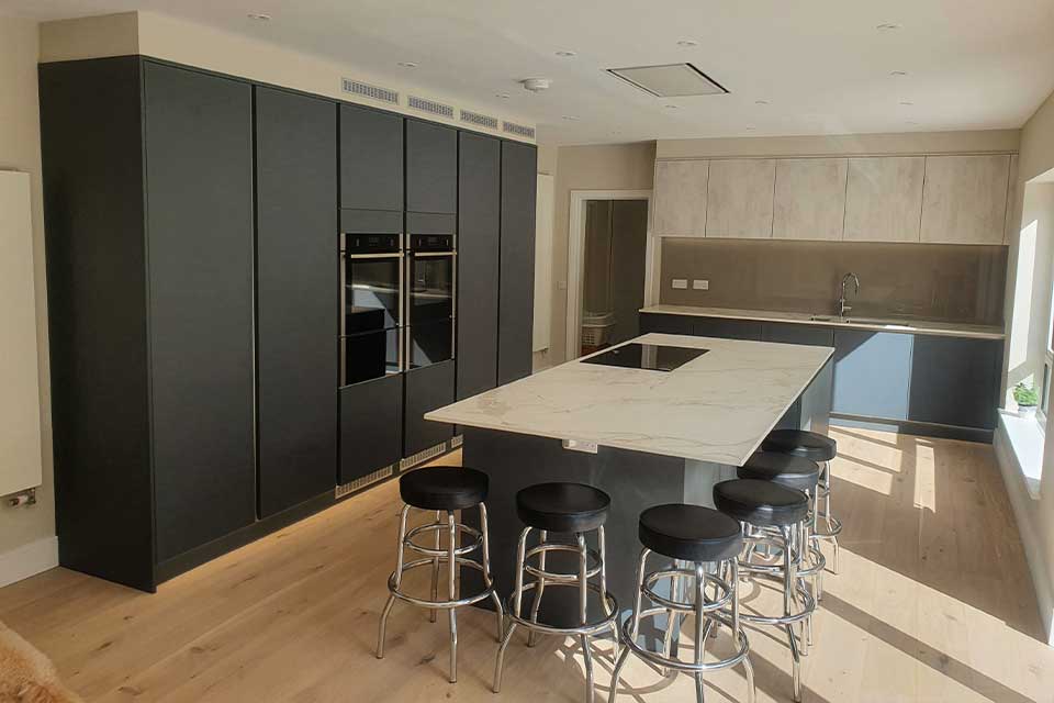 Green Handleless Kitchen by Sigma 3 Kitchens