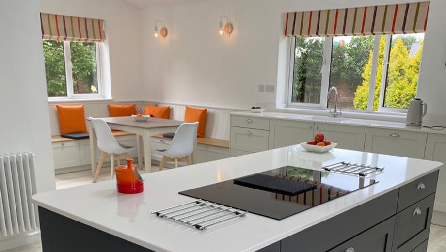 Grey kitchen with orange accents