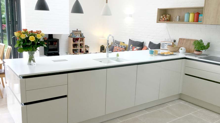 Handleless kitchen with graphite handle rail in Cardiff