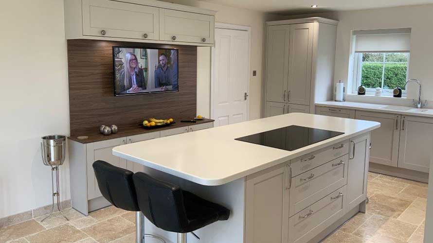 Grey shaker kitchen with media unit and kitchen island