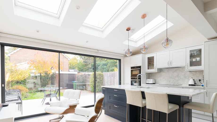 Kitchen renovation in Surrey featuring blue kitchen island