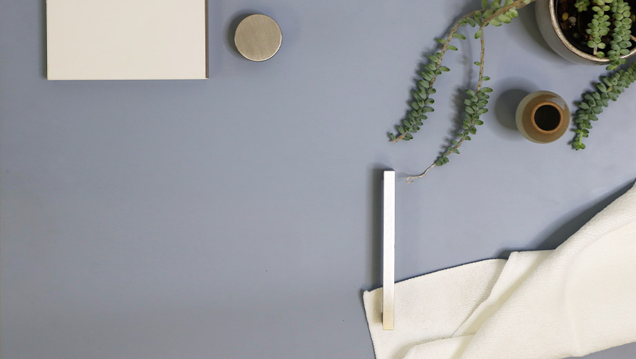 Light blue kitchen cabinets with silver brushed handles