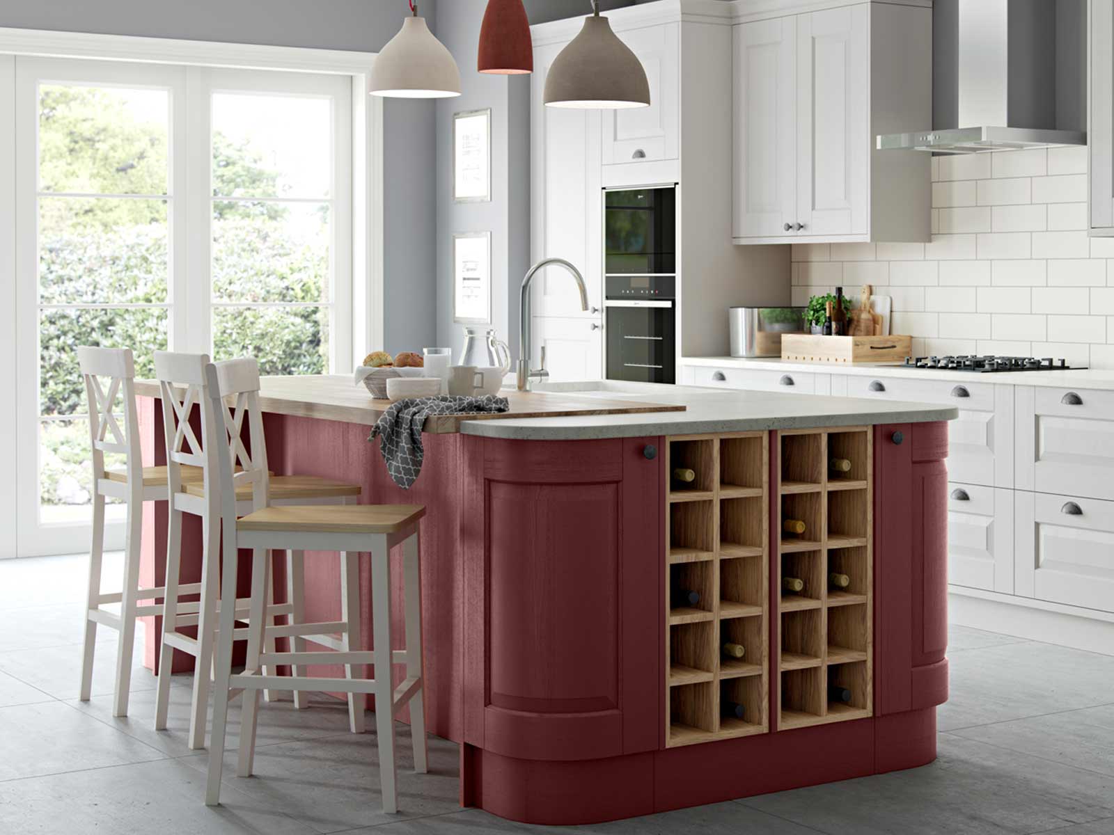 A perfect kitchen with rounded doors and wine pigeon holes in a kitchen island