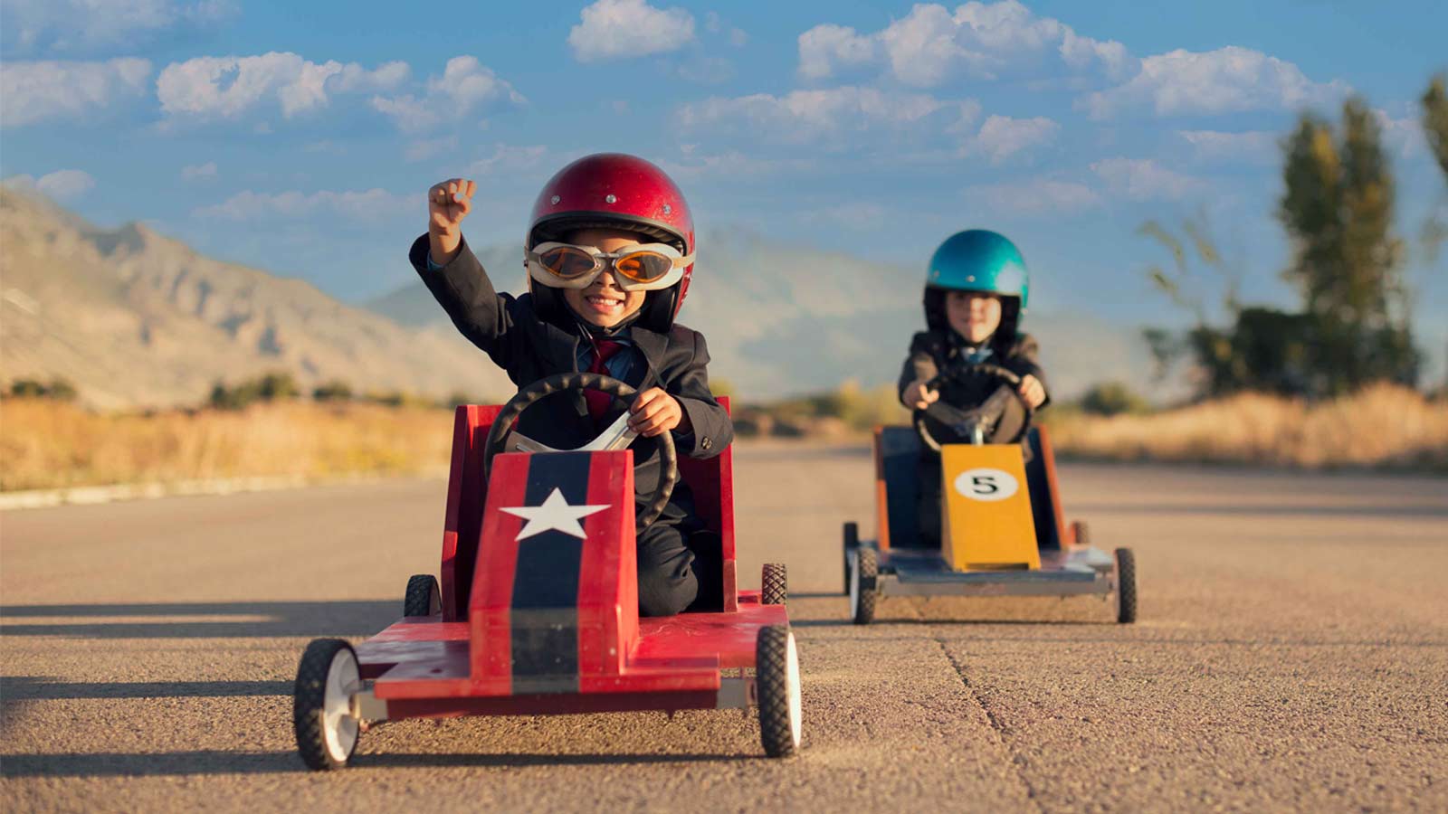 Go-karting children representing Wales outdoor activities