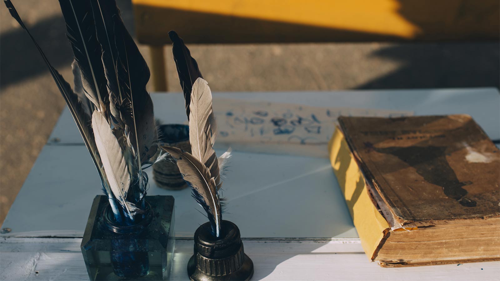 An antique book and quills to represent Wales’ literary heritage and current scene