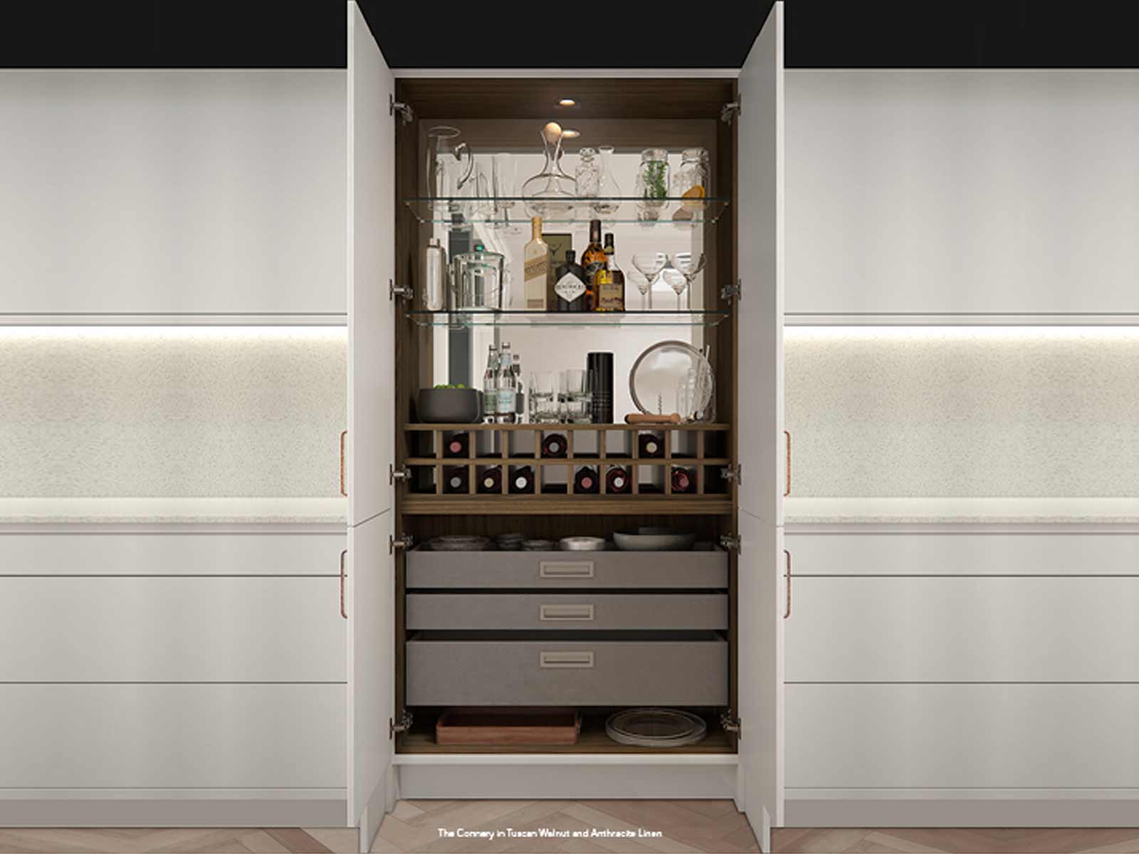 A fancy whiskey and wine cabinet with grey linen drawers in a handleless range