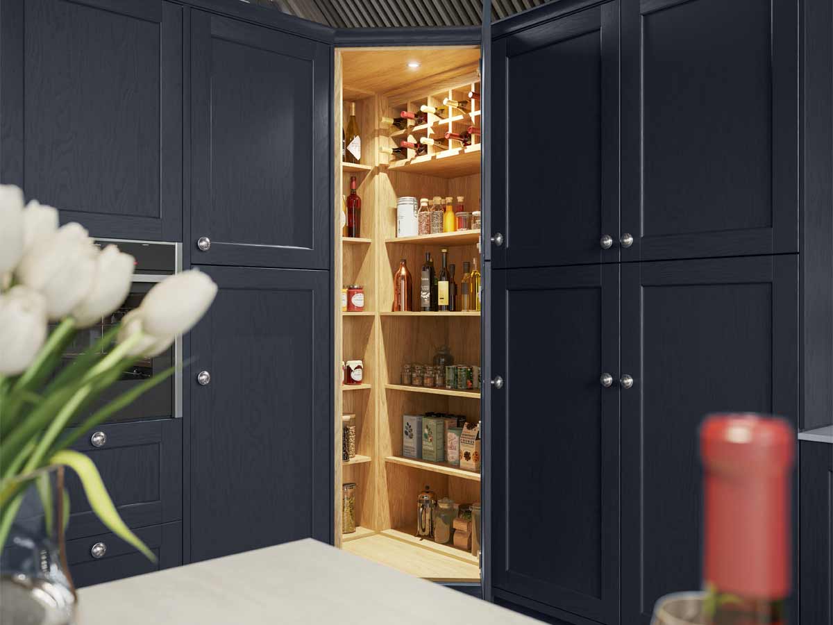 An organised pantry cabinet with oak shelves a navy shaker kitchen