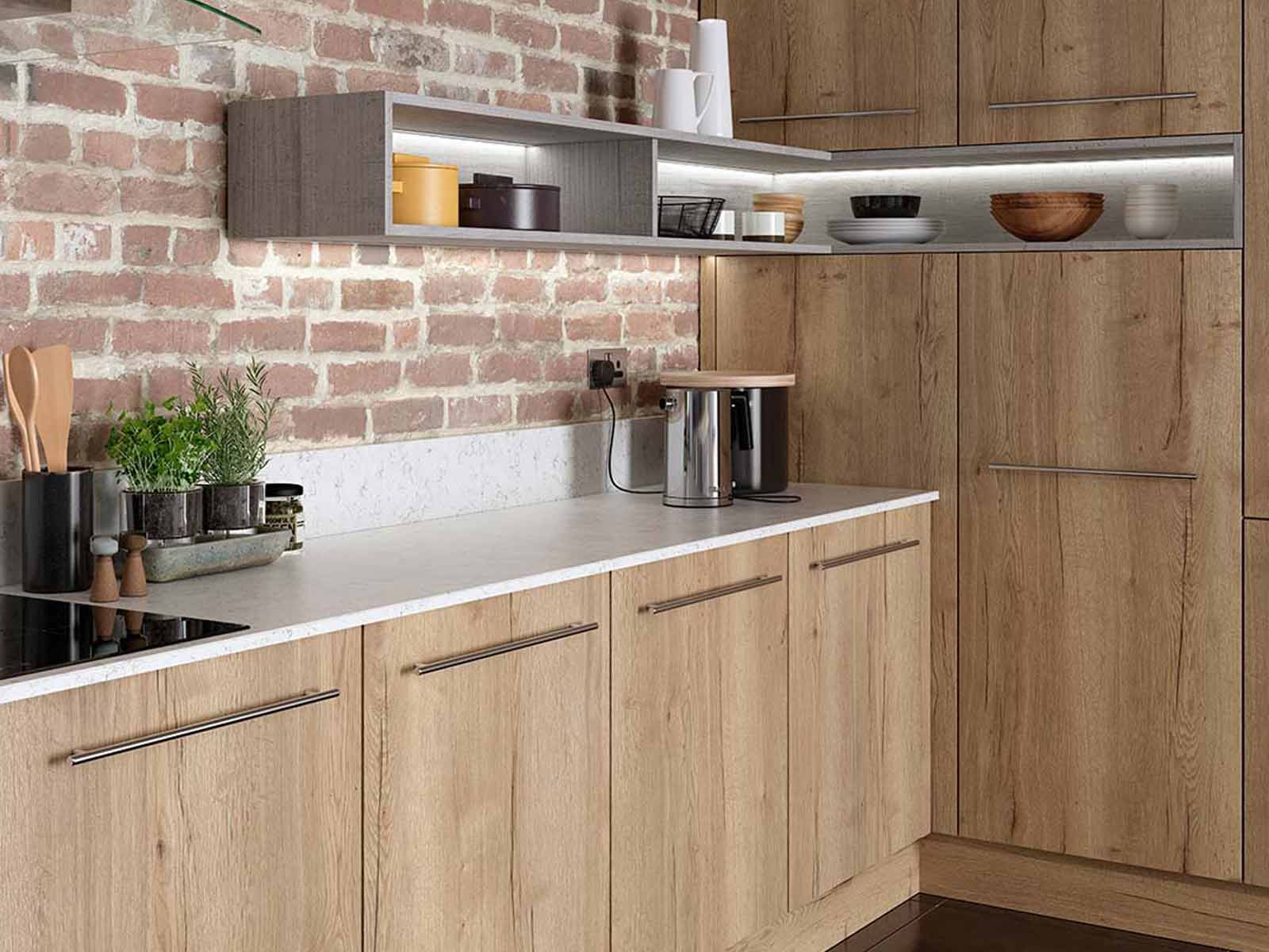 Portland oak kitchenette against a brick wall with floating shelves