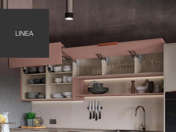 Pink LineaPlus wide cabinets with fold-up doors and a marble backsplash