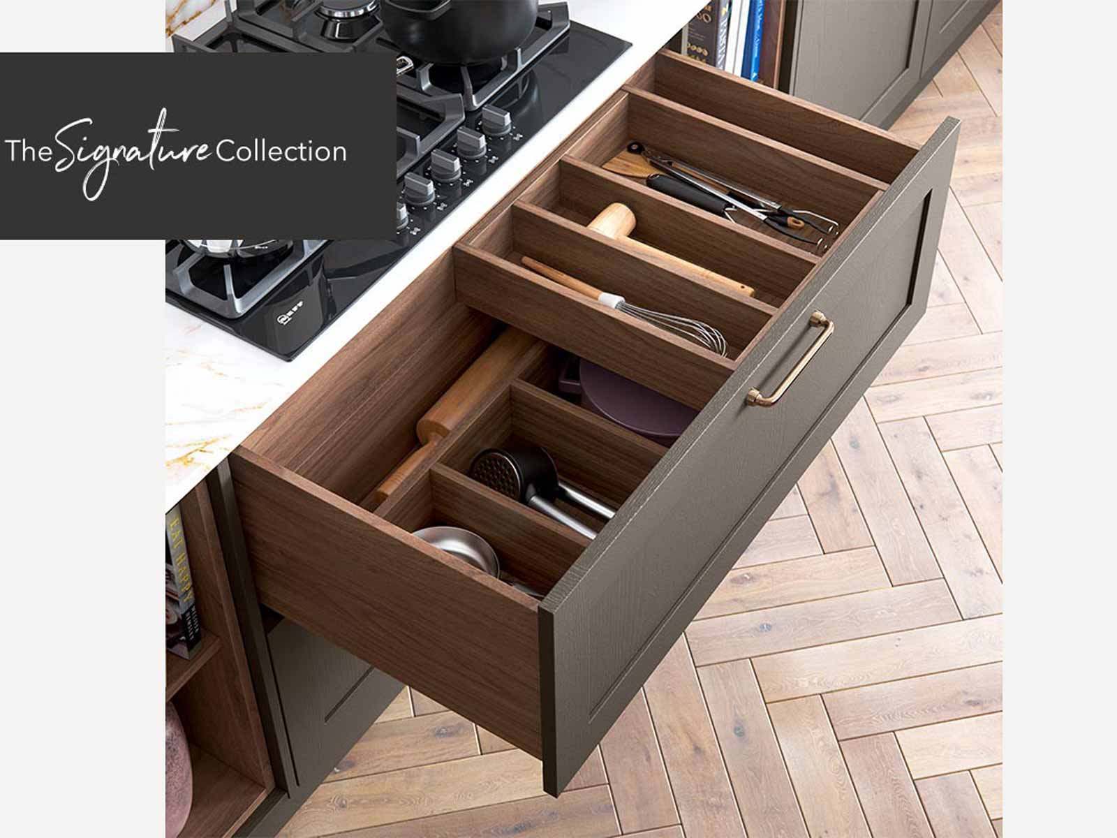 Extended kitchen drawer with wooden interior for utensils