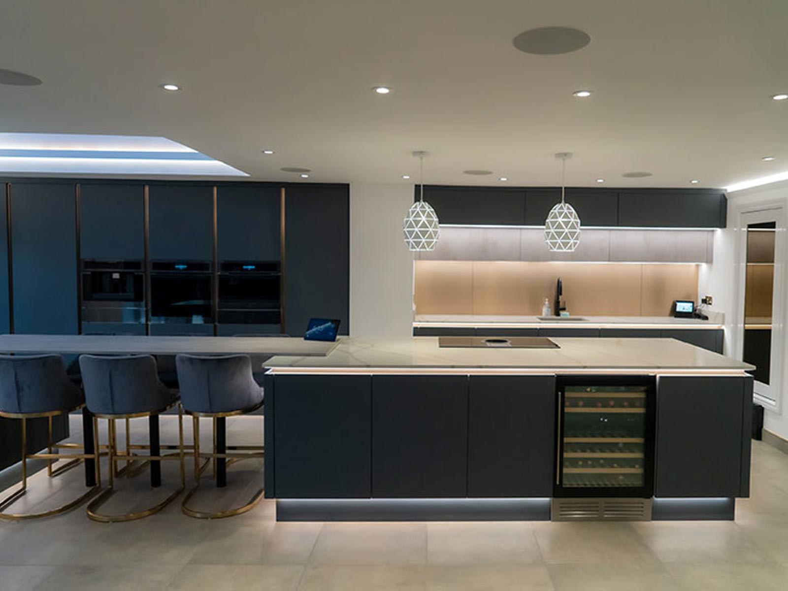 Modern home bar with origami kitchen ceiling lights and black cabinet lighting