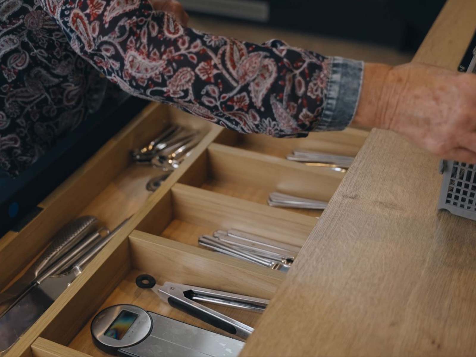 A kitchen drawer unit installed with an oak cutlery organiser