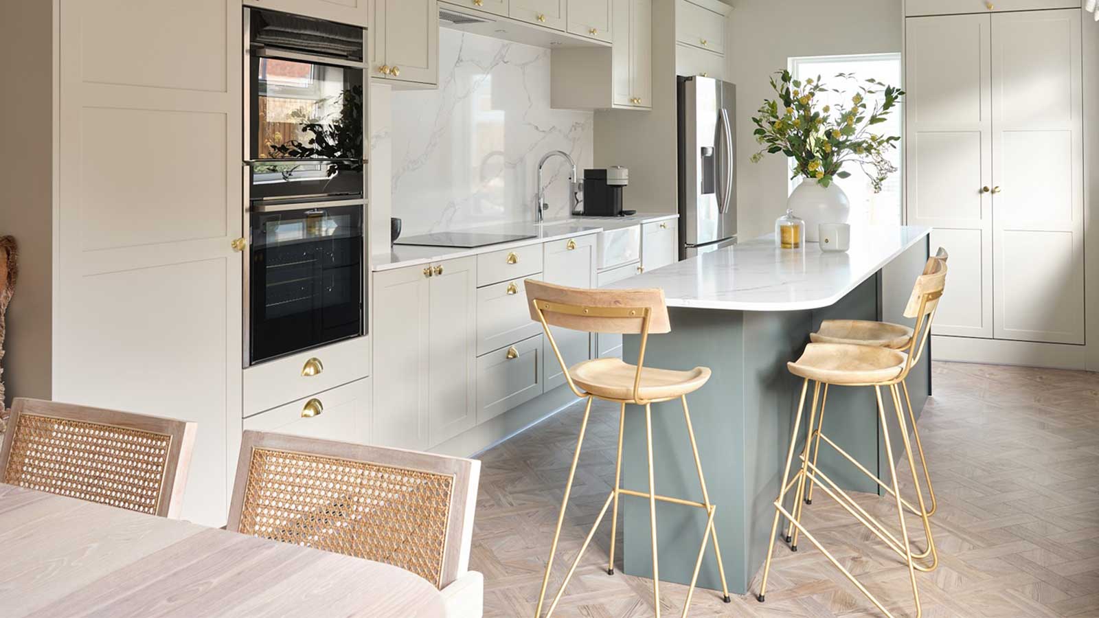 Galley-style kitchen with a kitchen island that makes a working triangle