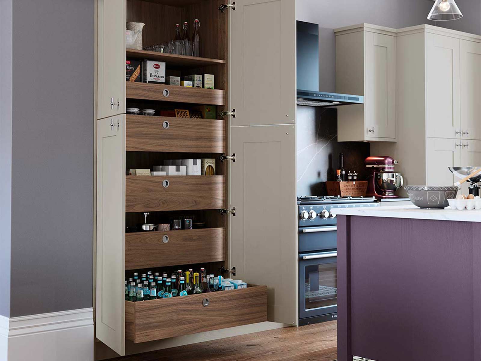 The larder kitchen unit storage pull-out option with walnut drawers