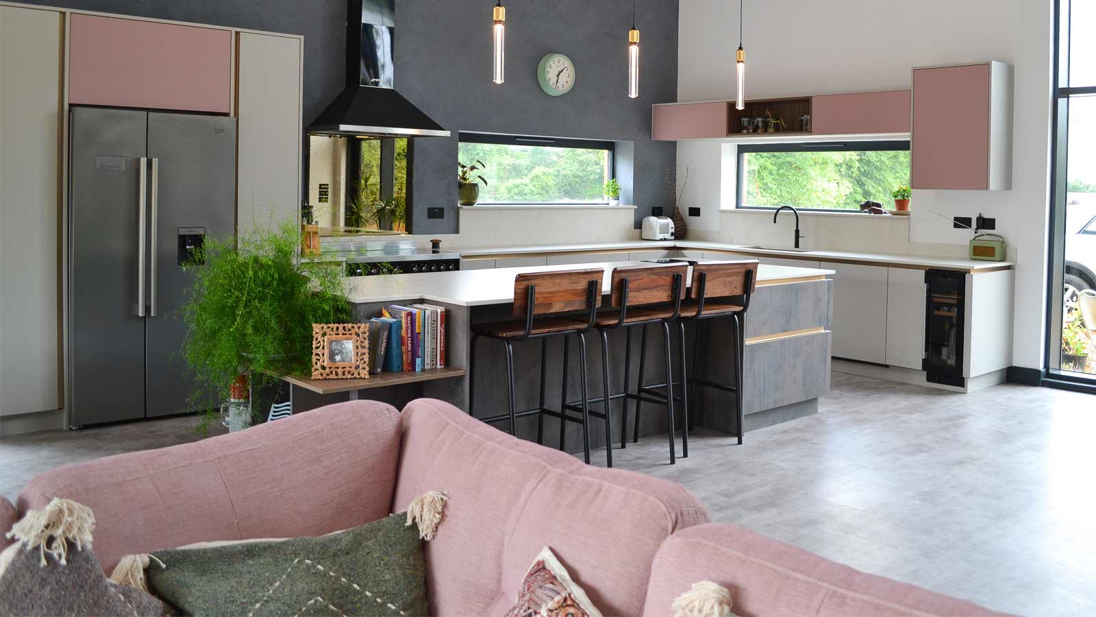 An open plan country room containing a western kitchen with western decor