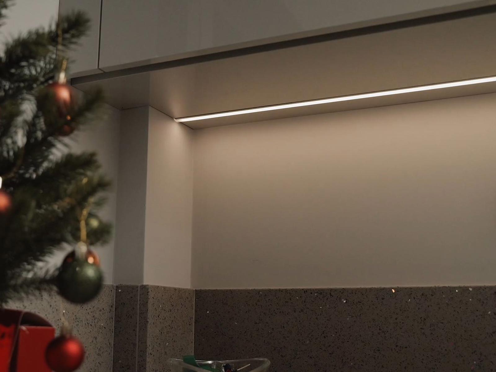 Kitchen lighting shown as kitchen ceiling lights with a quartz worktop splashback