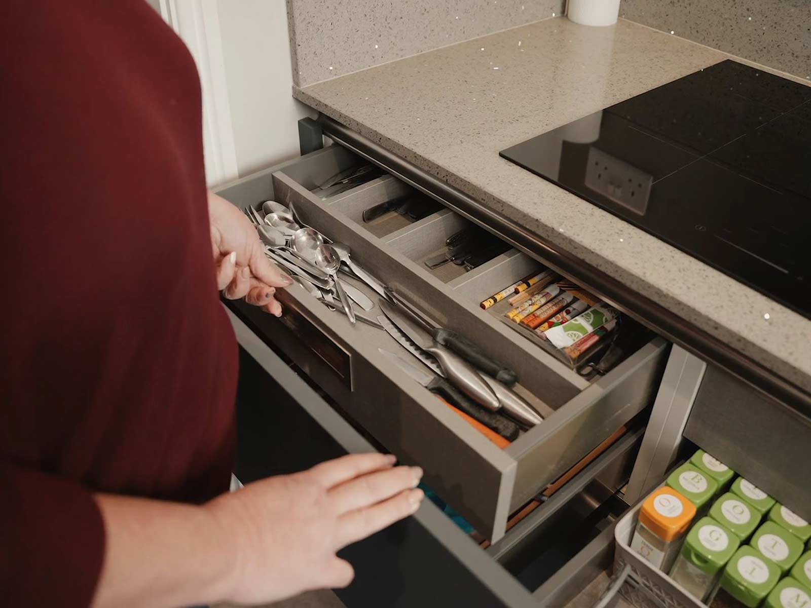 Modern kitchen cabinets with drawers built into a peninsula kitchen design