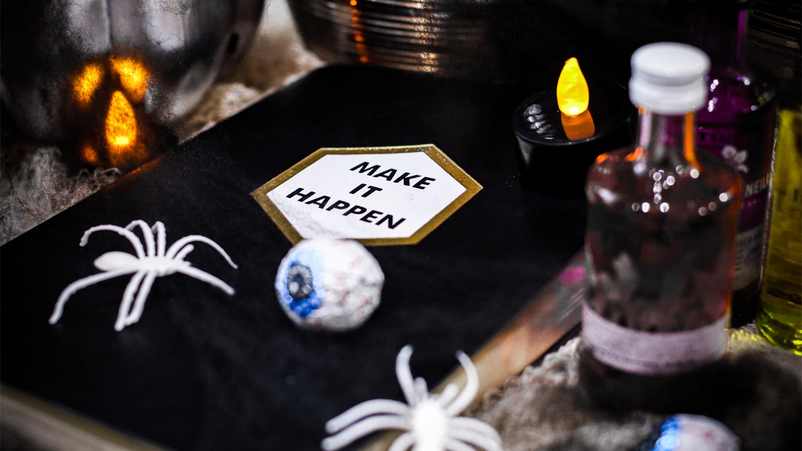 Halloween 2025 spiders, eyeballs, candles and potion bottles