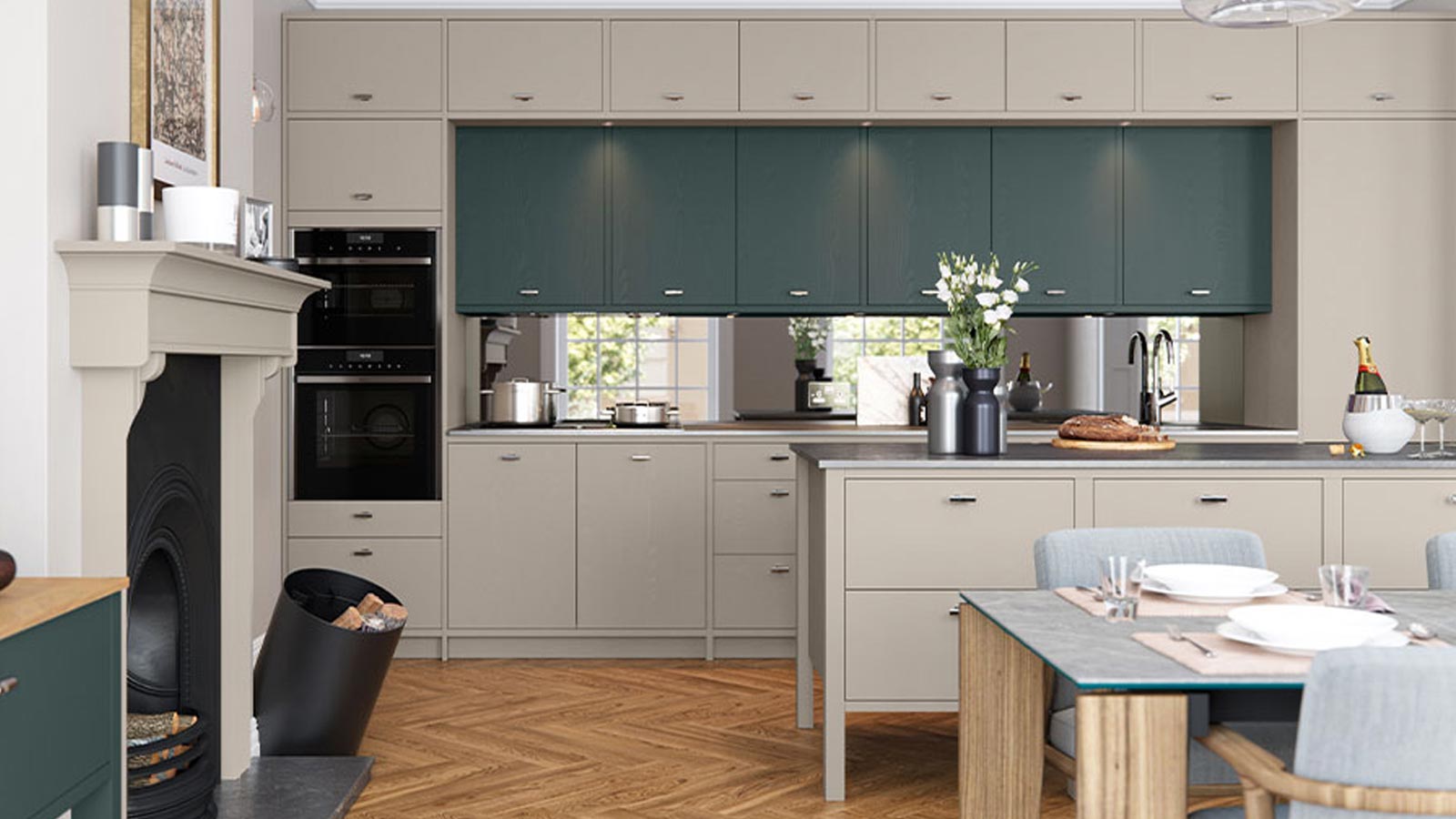 A light grey and dark green painted Oxwich kitchen with t handles
