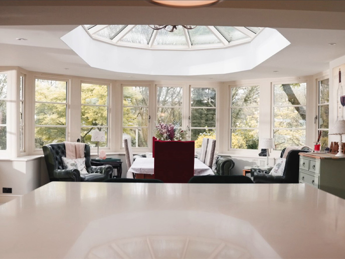An open concept family room and kitchen seen from the kitchen island