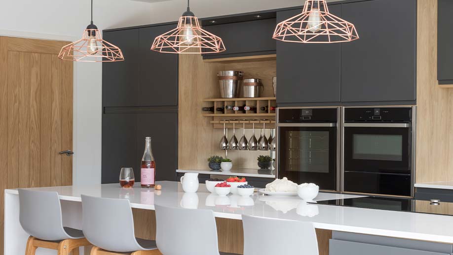 Modern kitchen featuring large kitchen island and wine storage