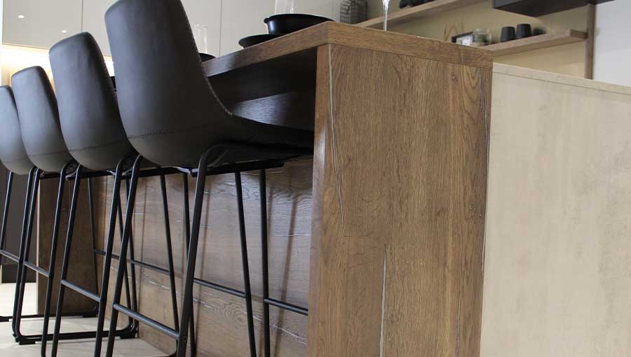 Wood effect breakfast bar in a modern luxury kitchen