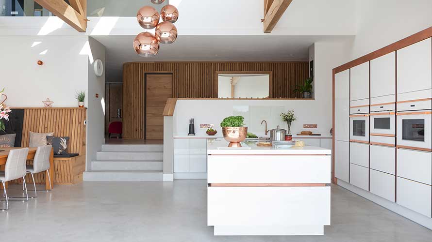 White gloss kitchen with rose gold accents