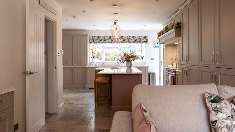 A traditional pink and grey kitchen