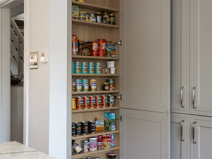 A tall in-frame kitchen larder for canned foods