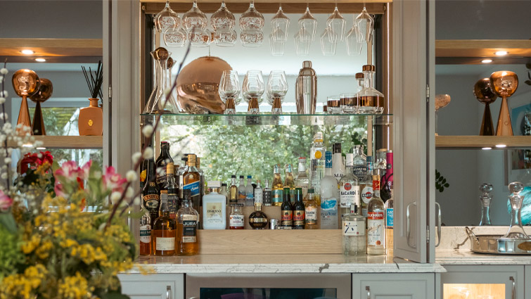 A wide kitchen Bar Dresser with bi-fold doors and an in-frame style