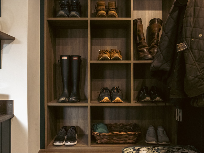 Open shelving in a utility room with in-frame kitchen cabinets