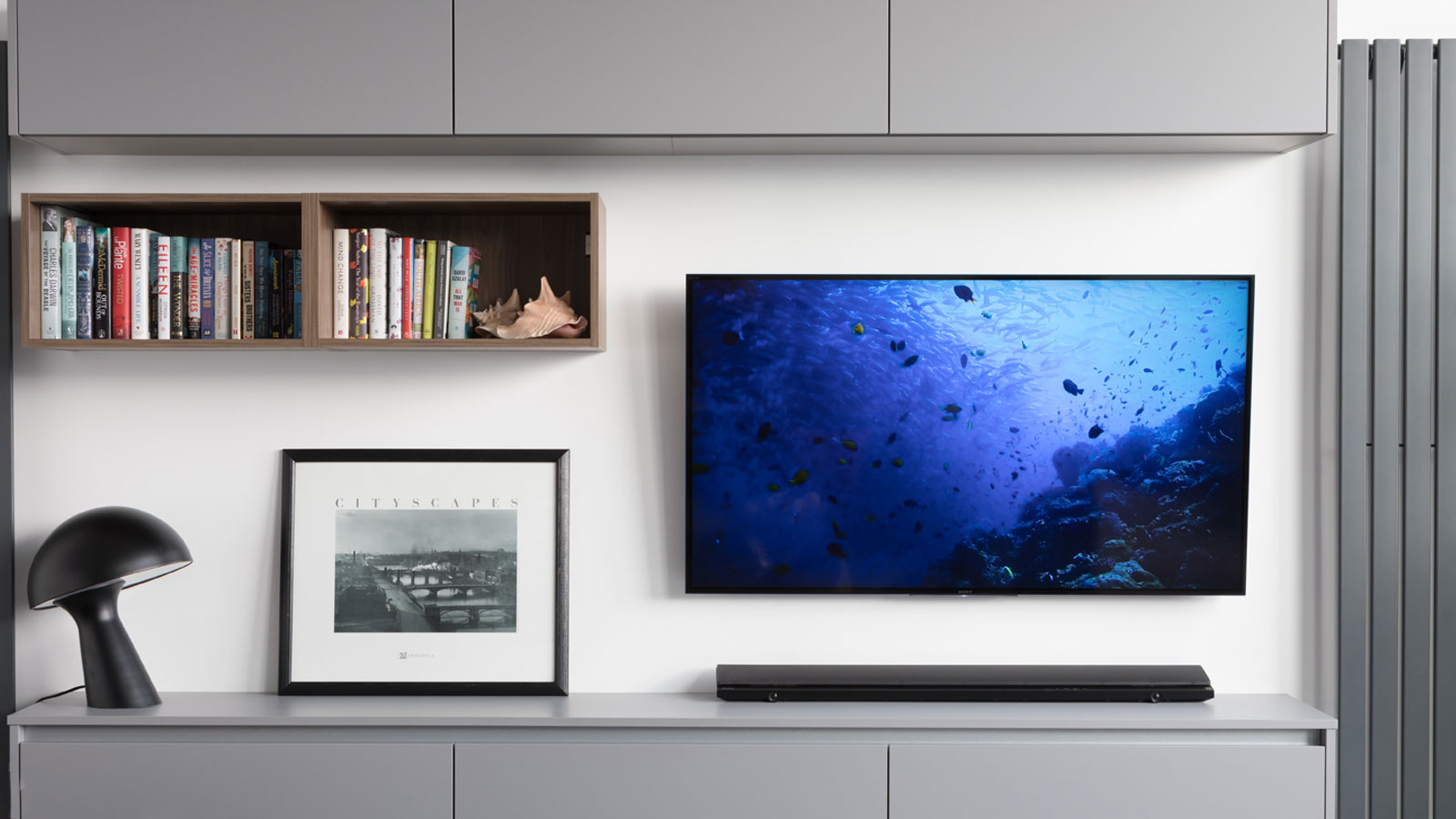 Media wall with shelves and a TV perfect for a social community kitchen