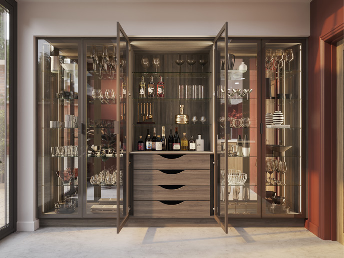 A dark wood pantry with drawers and glass doors
