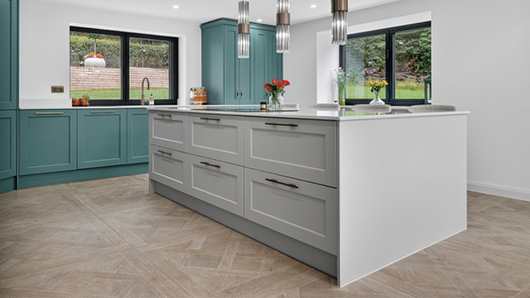 A modernised kitchen with a large kitchen island