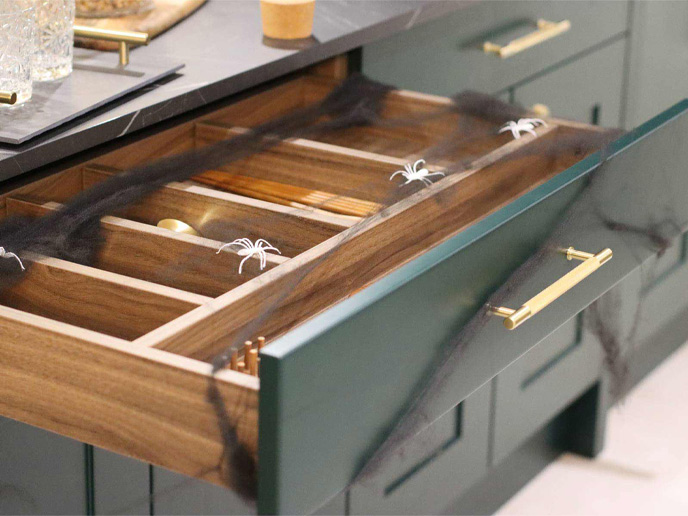 Oak finish kitchen cabinet drawers fitted with Halloween decorations