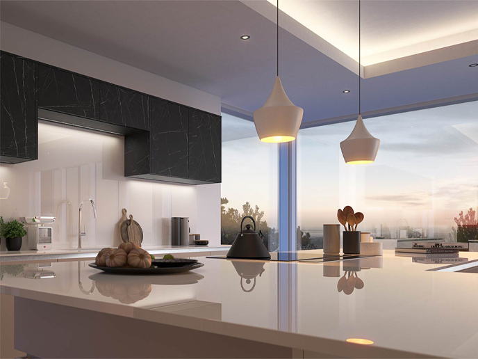 A grey handleless kitchen with black kitchen doors without handles