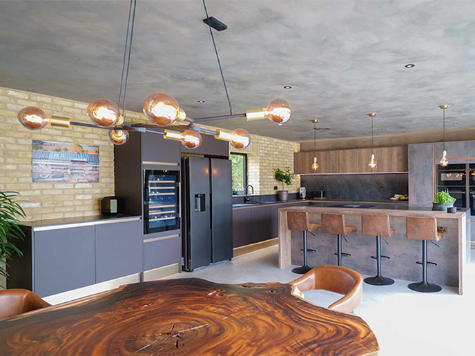 A Grand Designs gold and grey kitchen