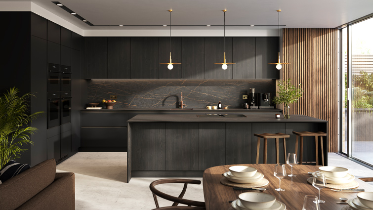 A dark wood kitchen with black and gold kitchen elements and dark wood counters
