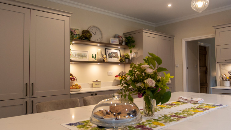 A mushroom kitchen with a large island and open shelving