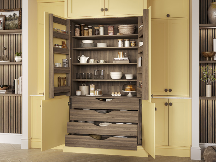 A Mediterranean kitchen’s Butter Yellow larder with walnut internals